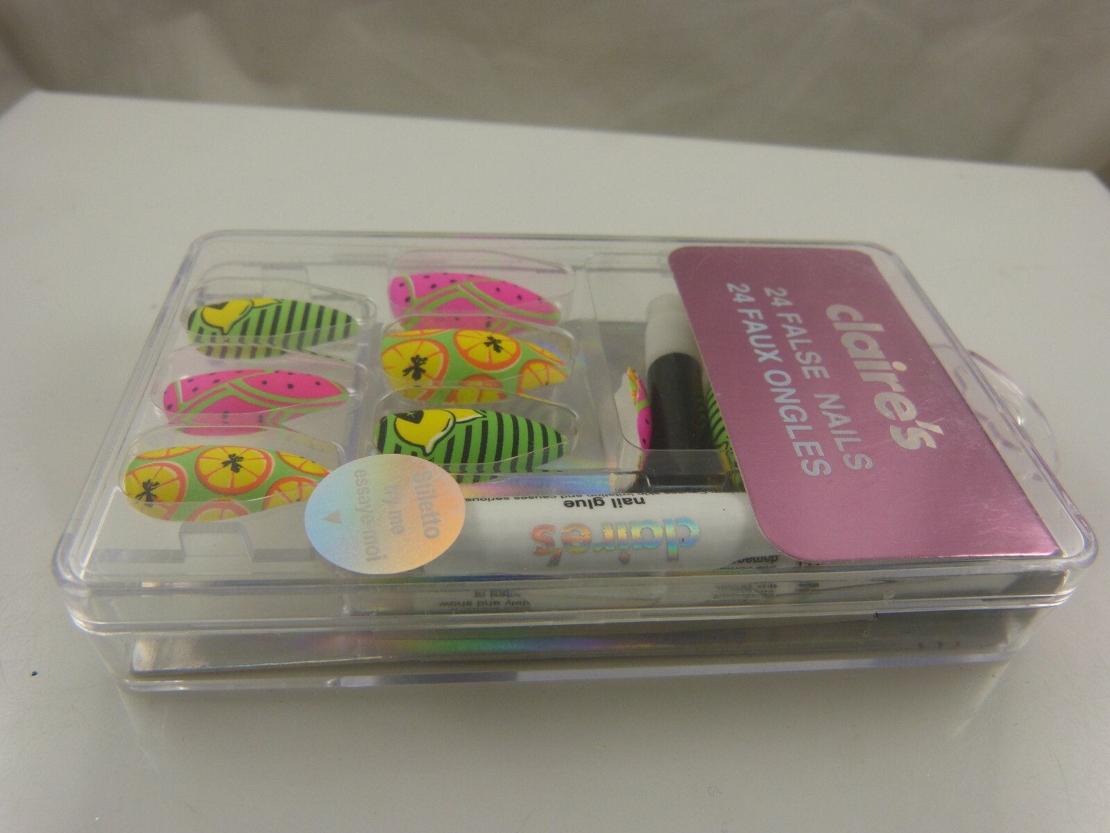 Claire’s faux finger nails neon colors with glue wild prints yellow pink green