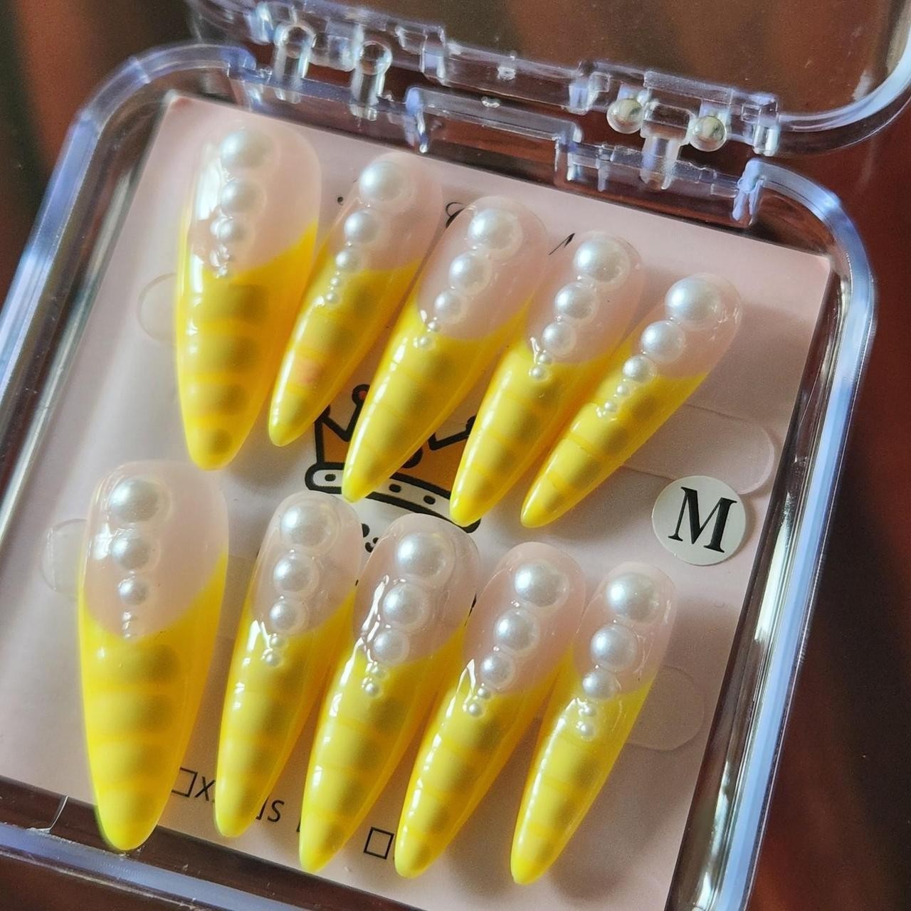 3.0 Yellow French tip stiletto press-on nails with pearls. Size M.