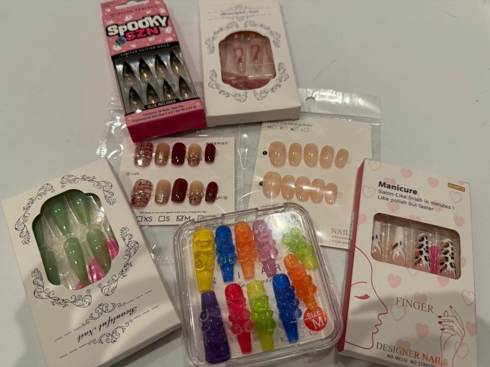 7 Pair Press On Nails. Medium and Multiple Size Sets. New In Package