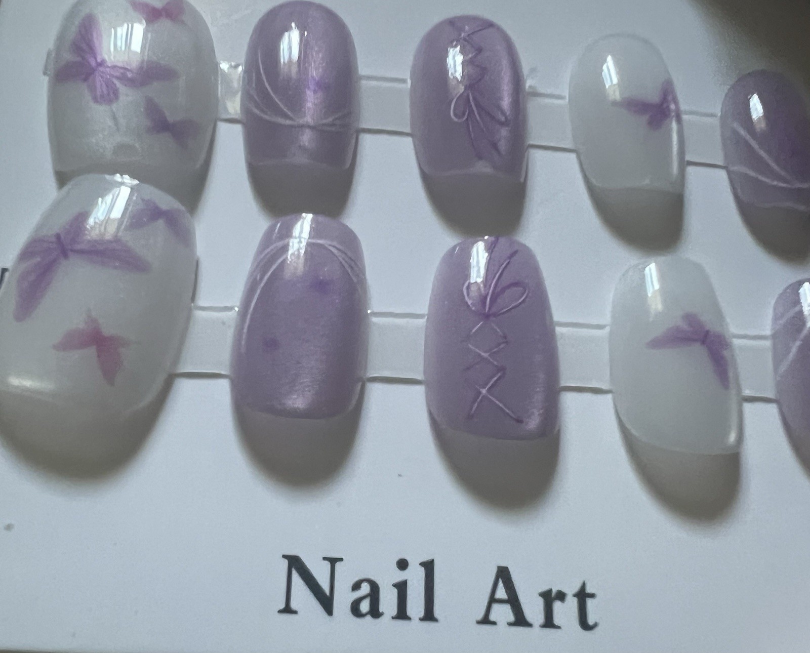 Set of 4 packs. Pink/White/Purple French Butterfly Press-On Nails Medium Oval.