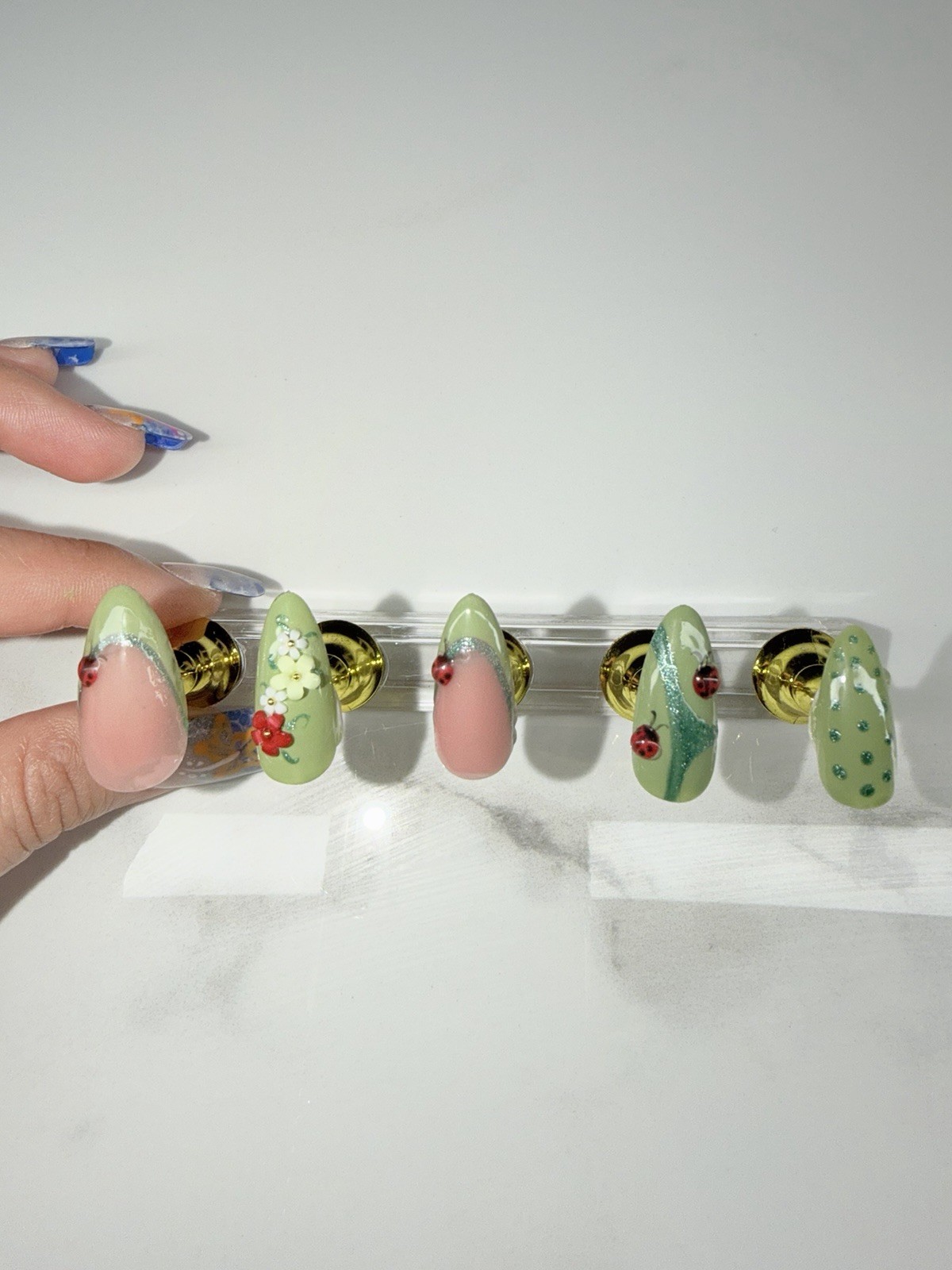 Custom green press on nails with 3D ladybugs & flowers. DM for sizing