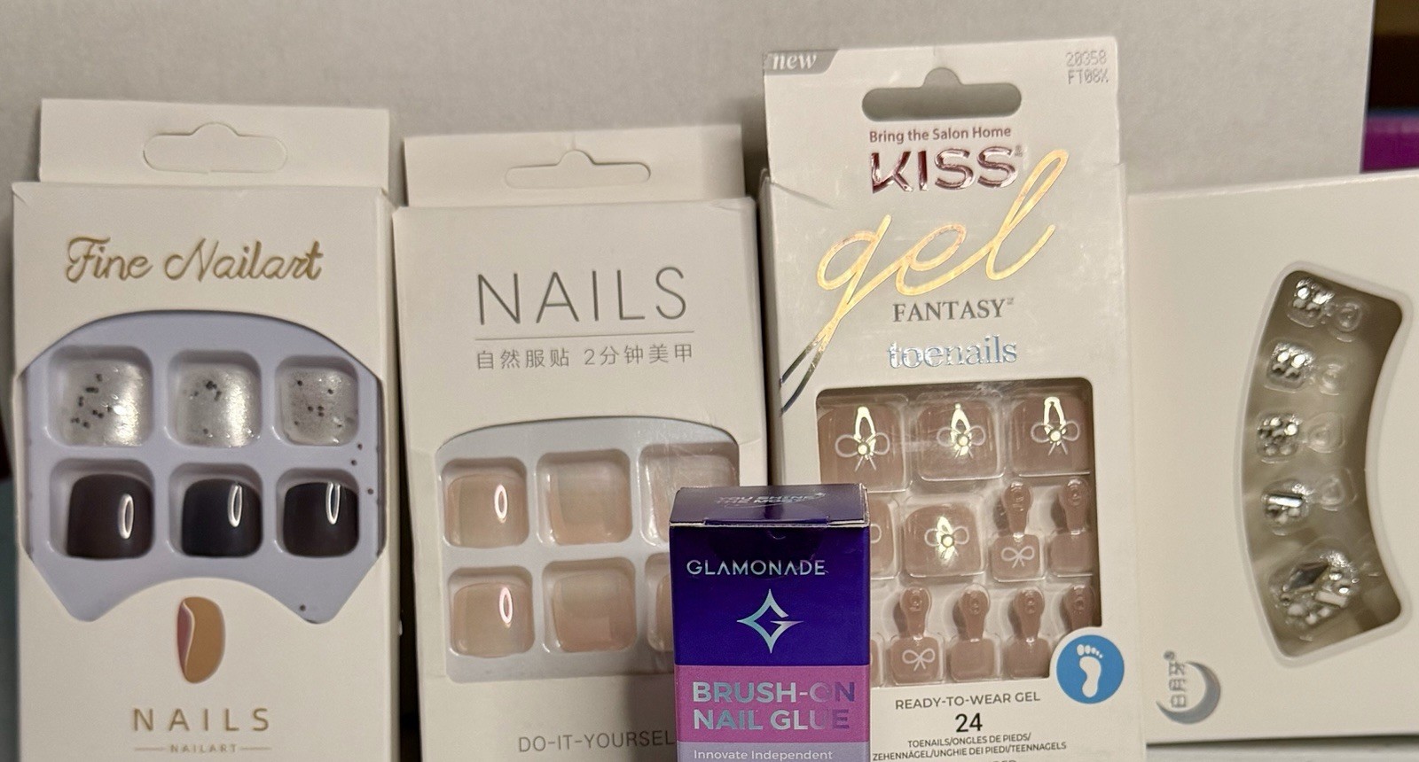 Bundle Press-On Toenails. 4 sets of nails and brush on glue.