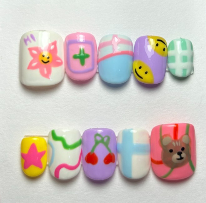 Multi-colored acrylic nails with cartoon characters and patterns #kawaii
