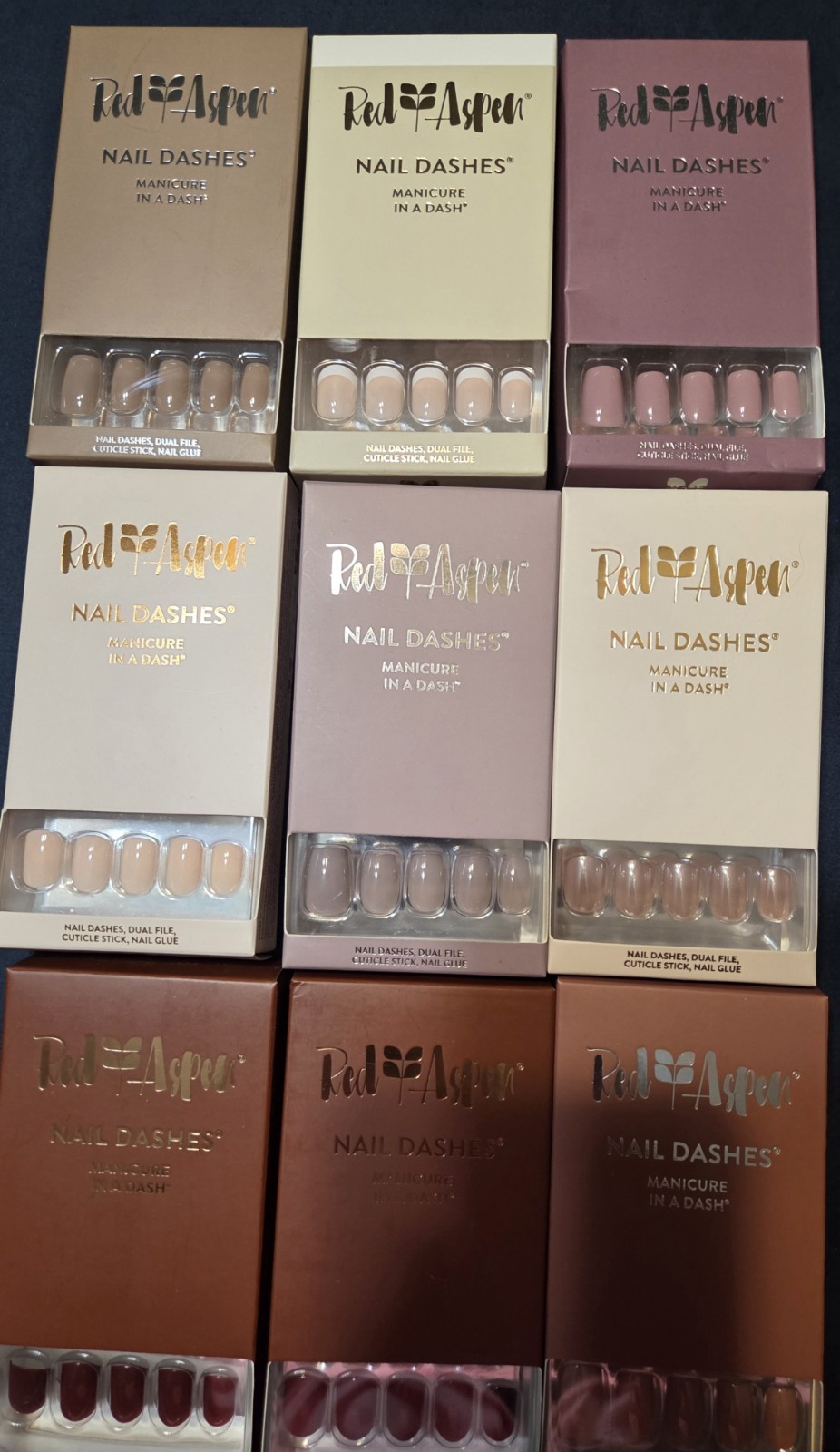 32 Sets of Red Aspen Press-On Nails including Acrylic and Multicolor Glitter