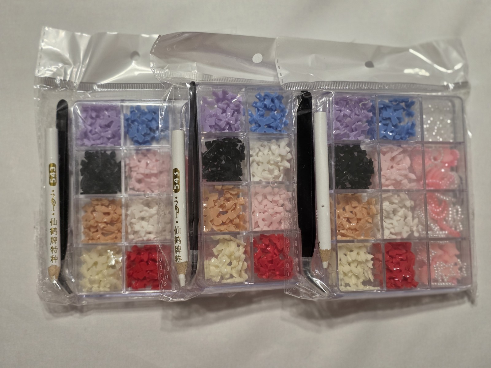 Nail Tech Supply Lot: 600pc Tips, 3x 3D Bow Charm Kits, Bottles, Hello Kitty