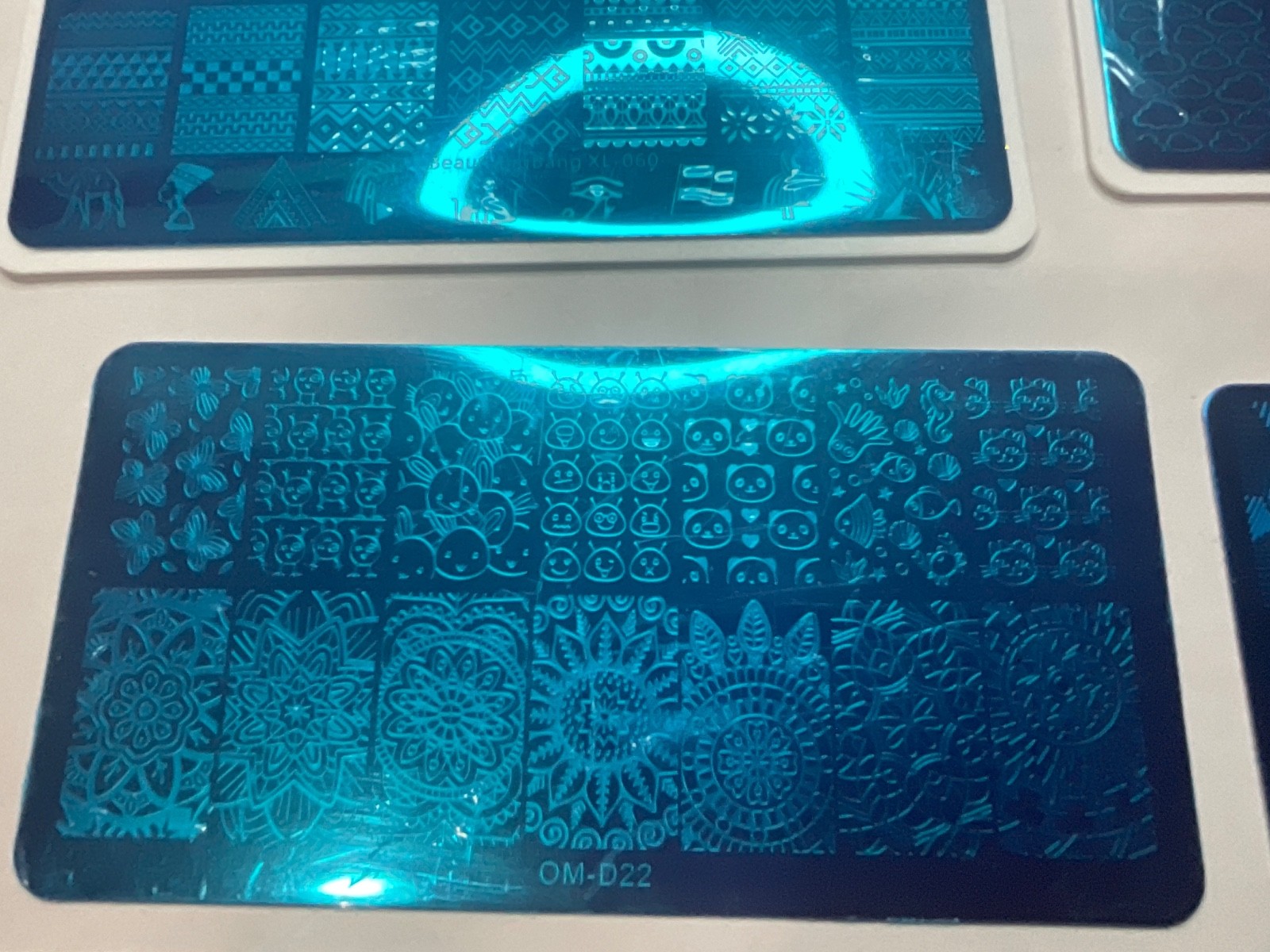 Mixed nail stamping plate bundle featuring multiple brands