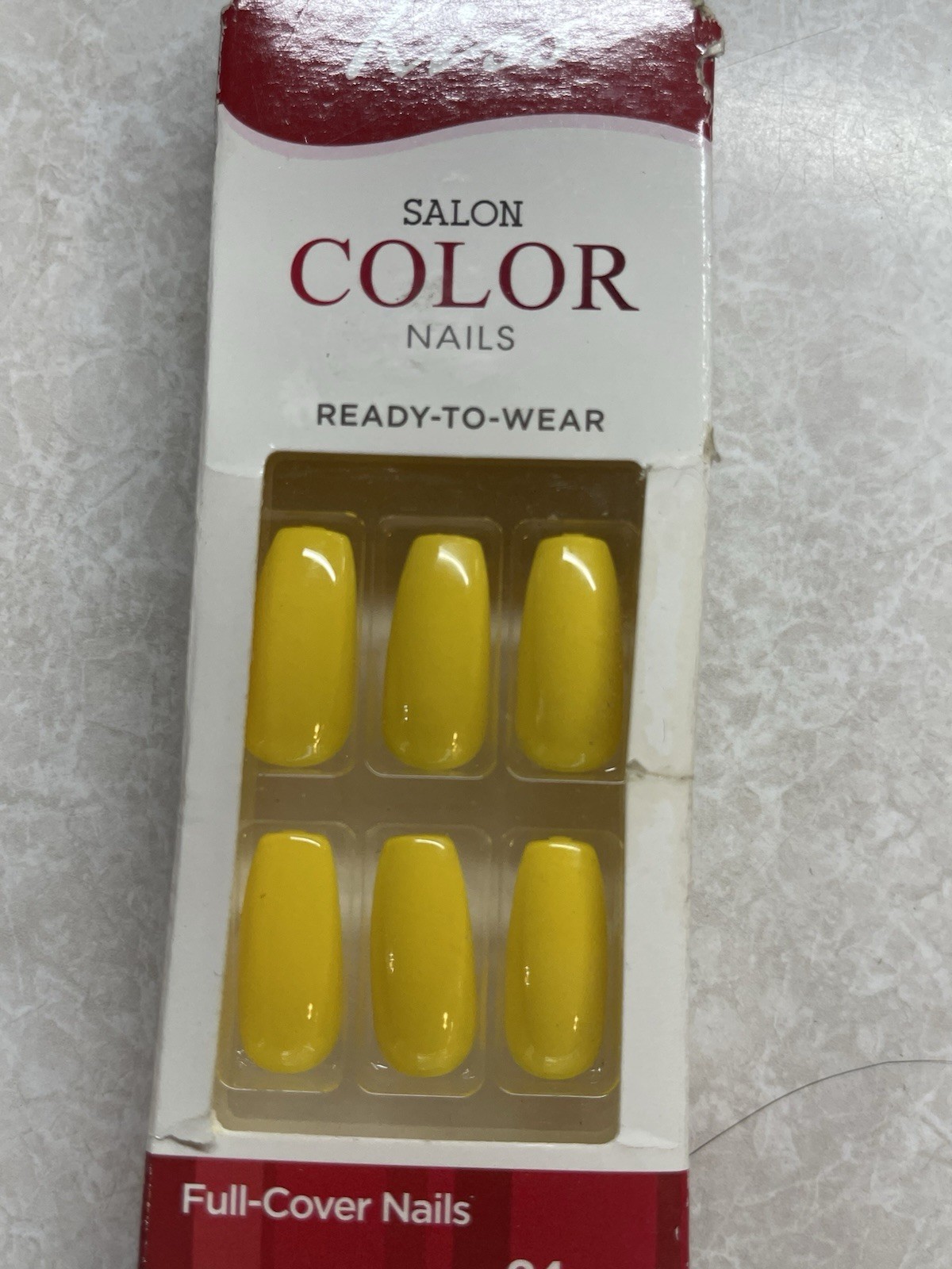 KISS Salon Color Ready-to-Wear nails in a glossy yellow finish.