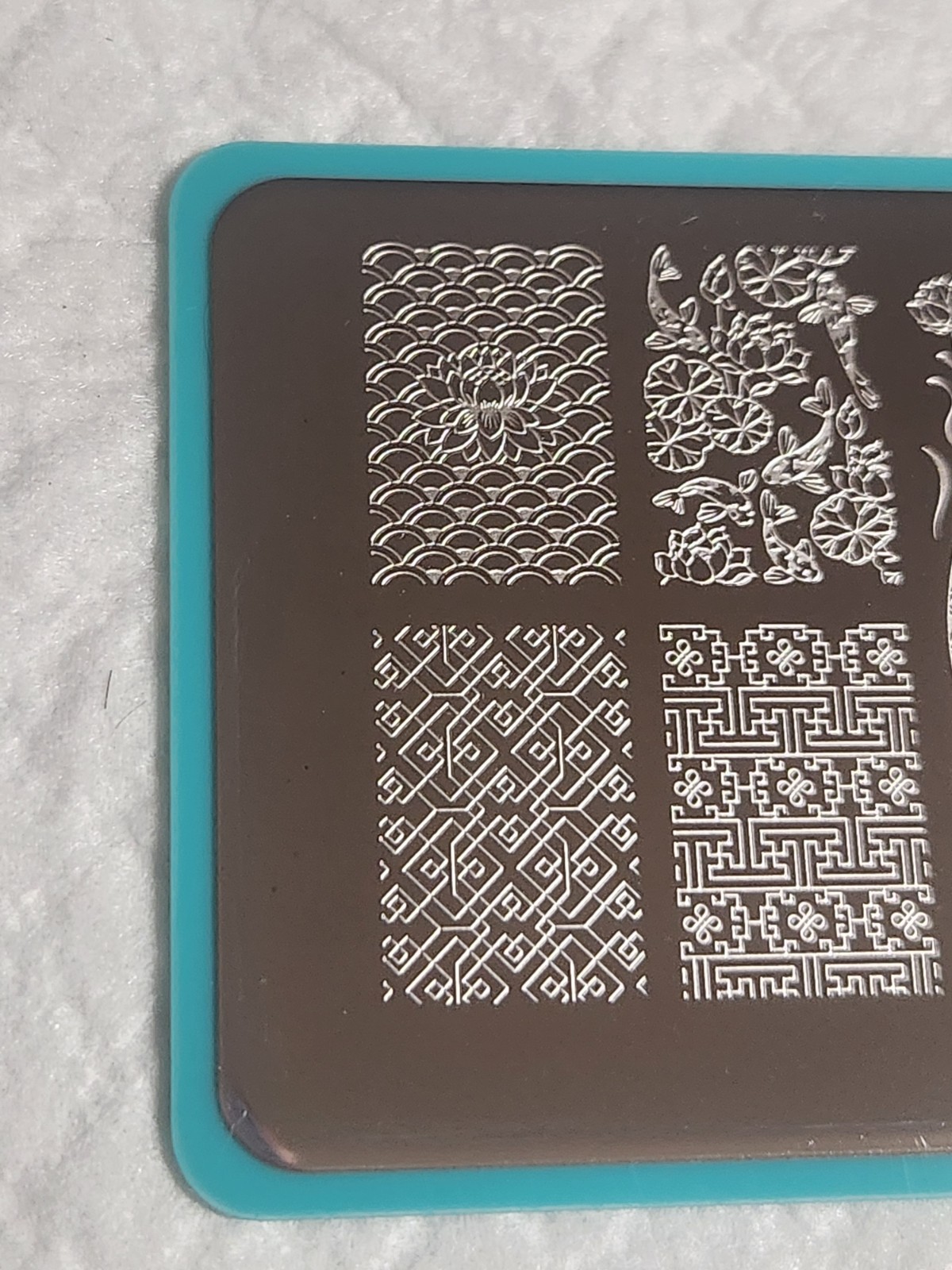 Maniology Nail Stamping Plate – M112 – Koi Pond