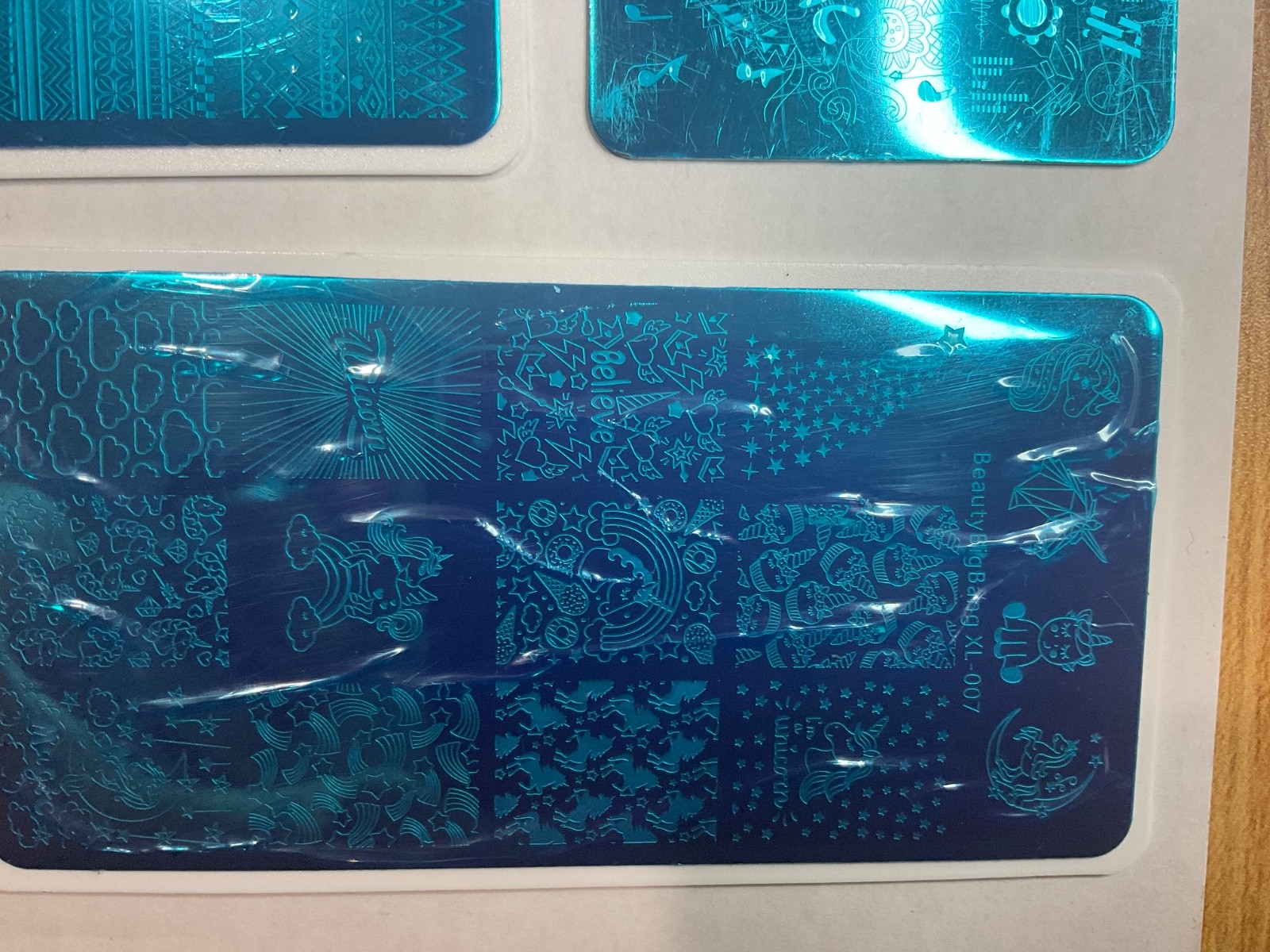 Mixed nail stamping plate bundle featuring multiple brands