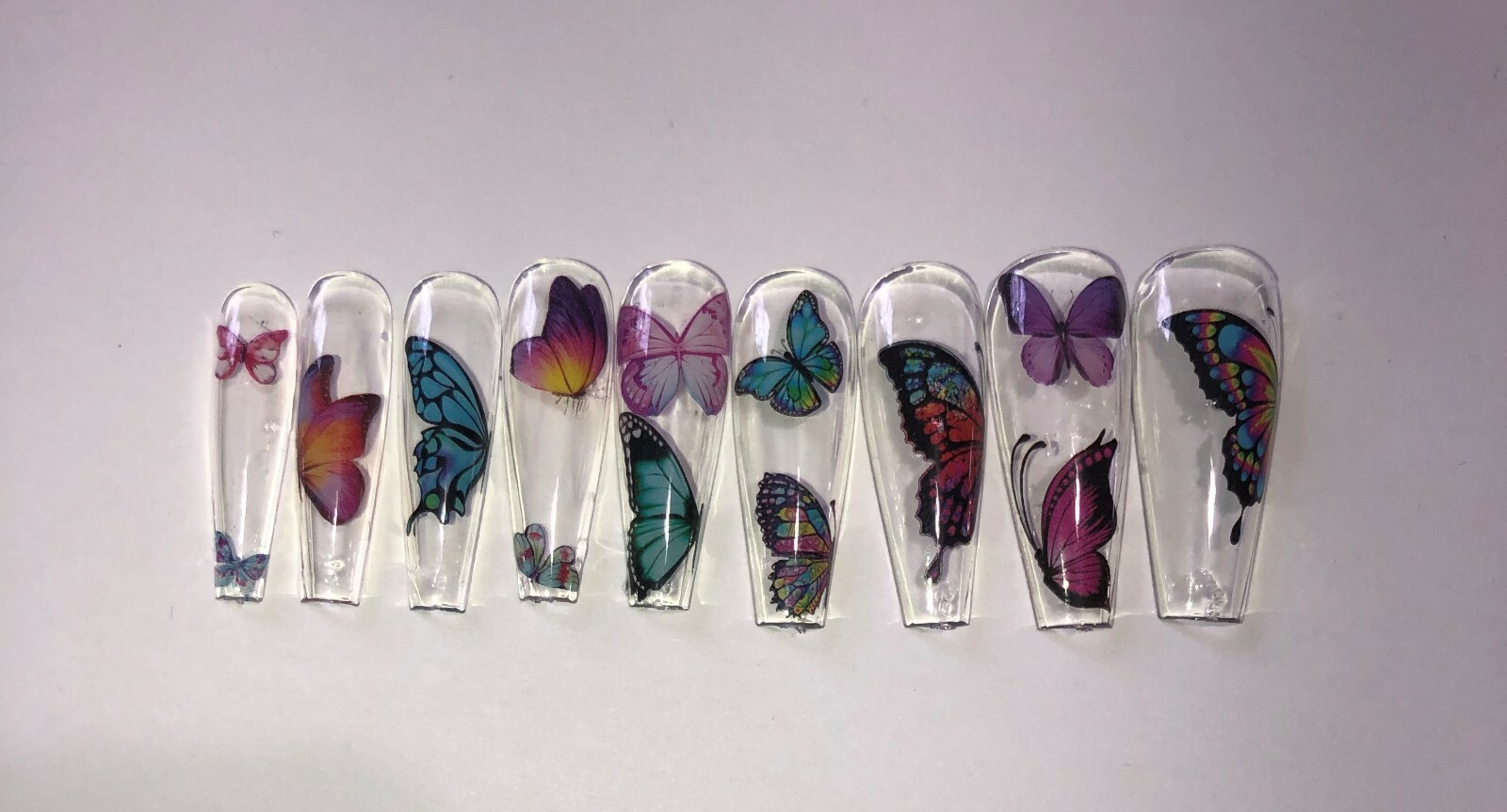 Press on nail set- Clear with Butterfly’s- (Set of 18 sizes 0-8)
