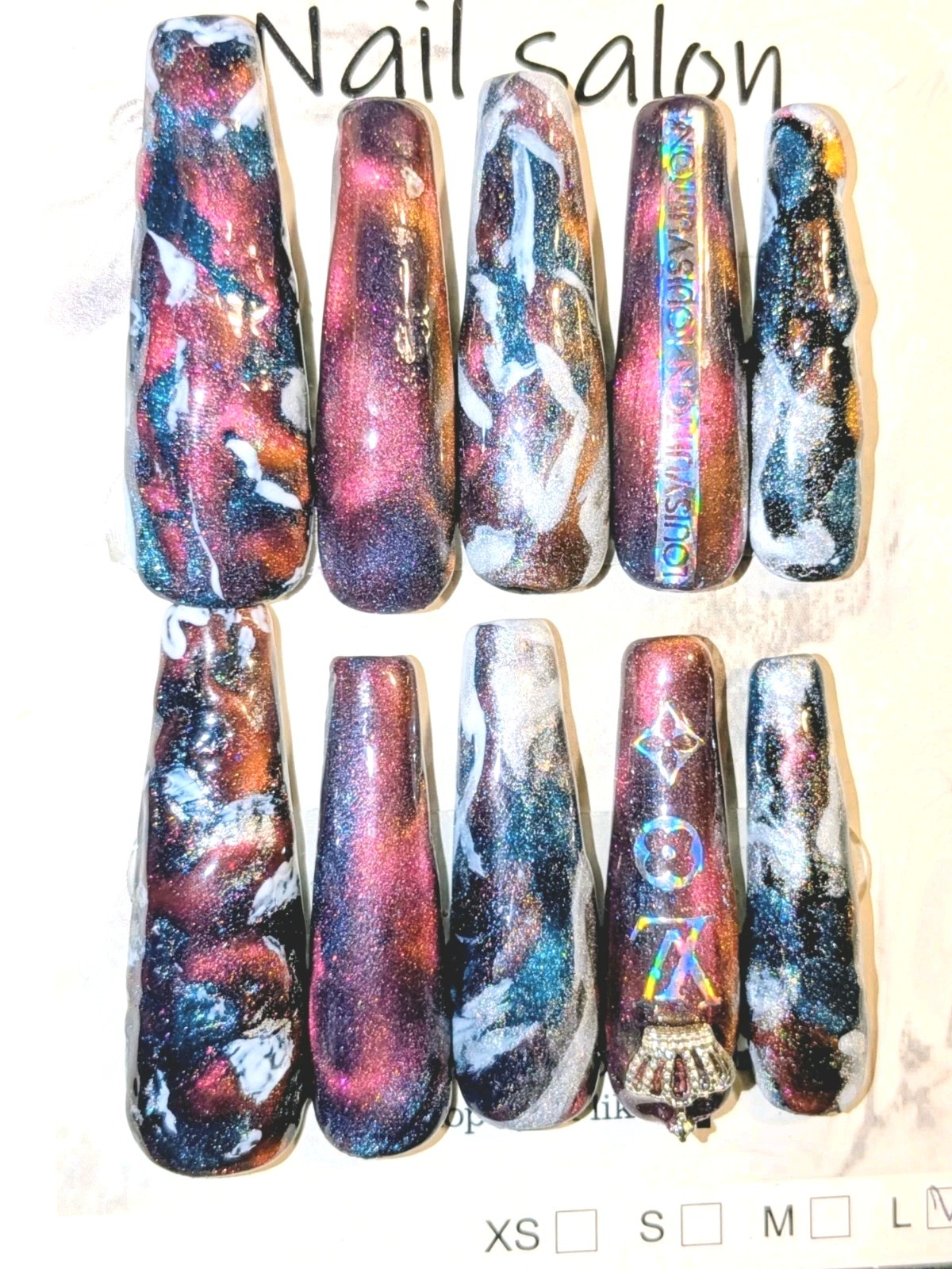 Shimmering Handmade Stunning galaxy-themed press-on nails with a mix of colors.