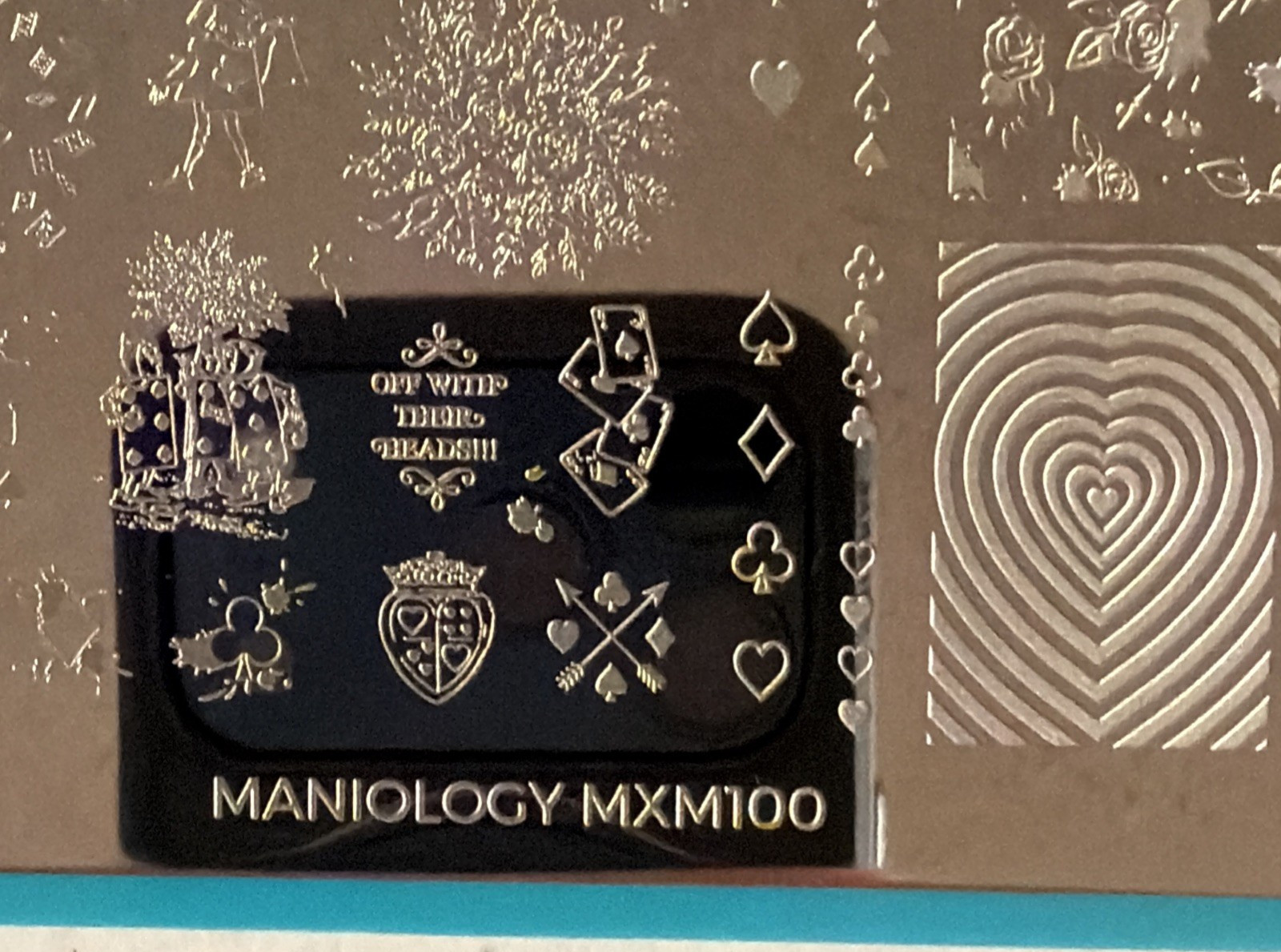 Maniology Through the Looking Glass: Mad for Tea MXM099 & Hearts & Havoc MXM100