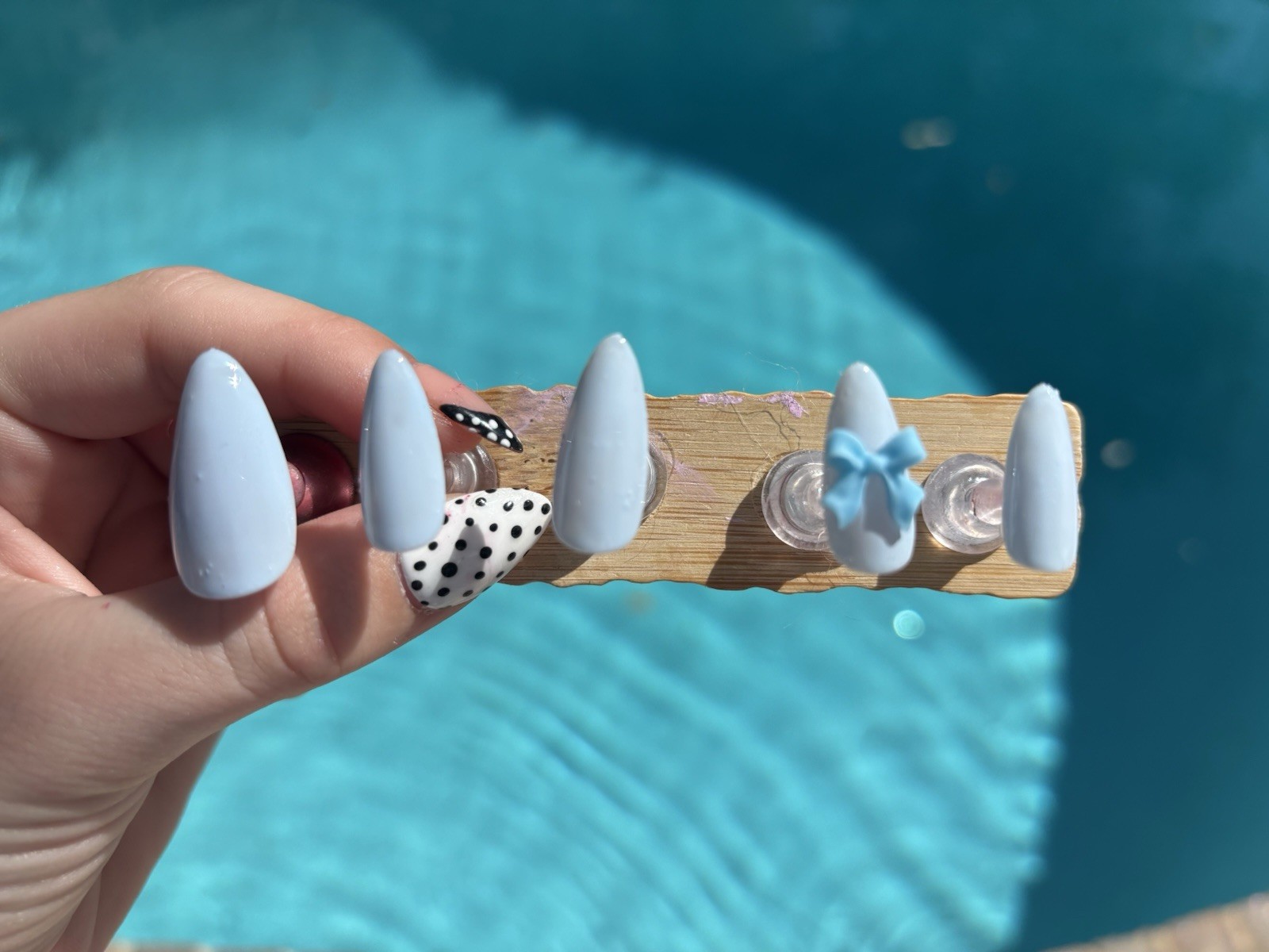 Beauty in blue, basic blue handmade nail design with a blue bow!