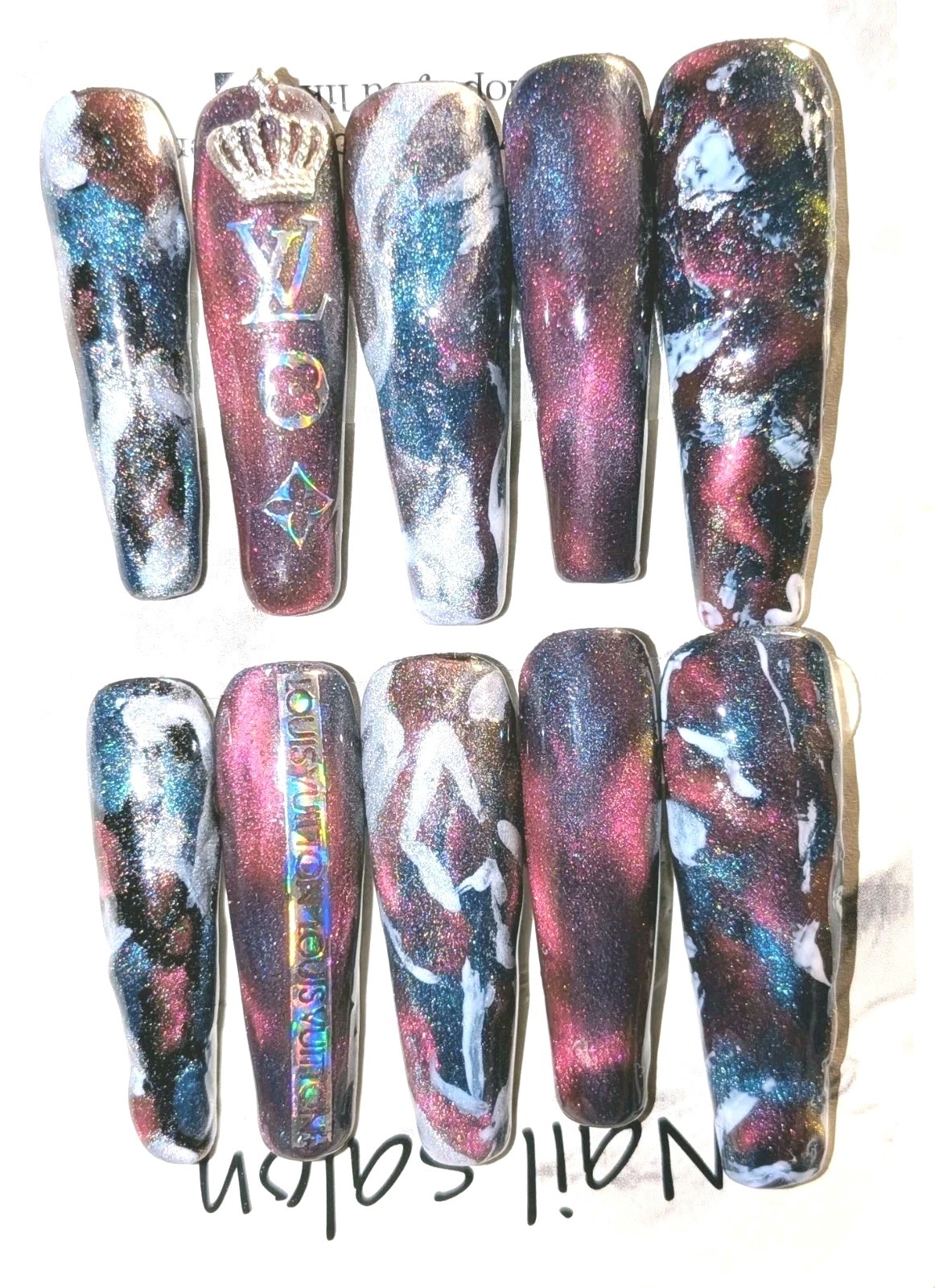 Shimmering Handmade Stunning galaxy-themed press-on nails with a mix of colors.