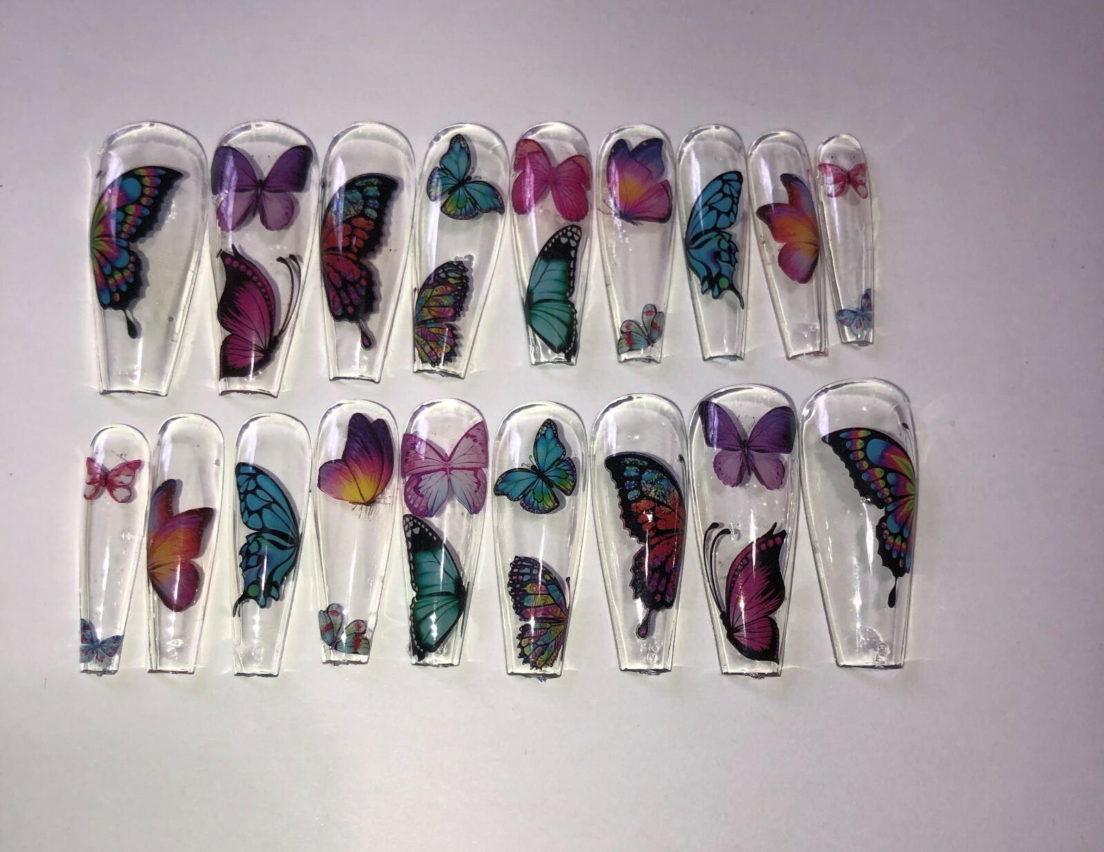 Press on nail set- Clear with Butterfly’s- (Set of 18 sizes 0-8)