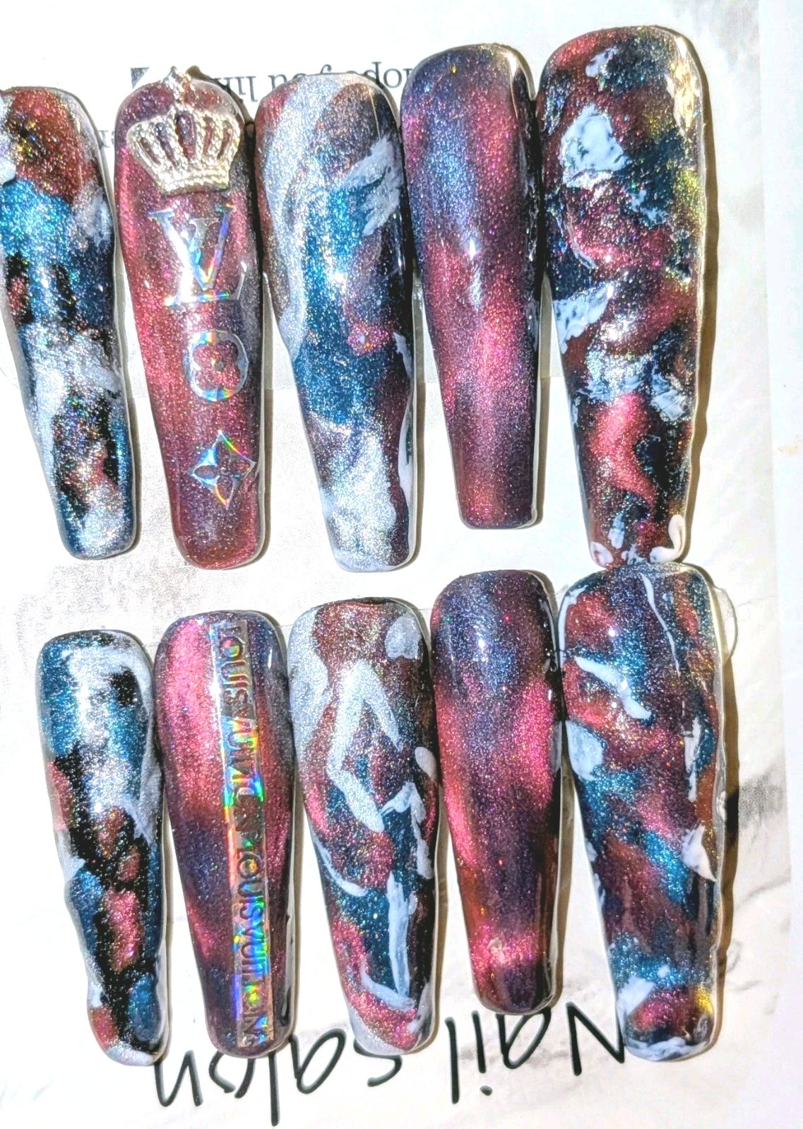 Shimmering Handmade Stunning galaxy-themed press-on nails with a mix of colors.