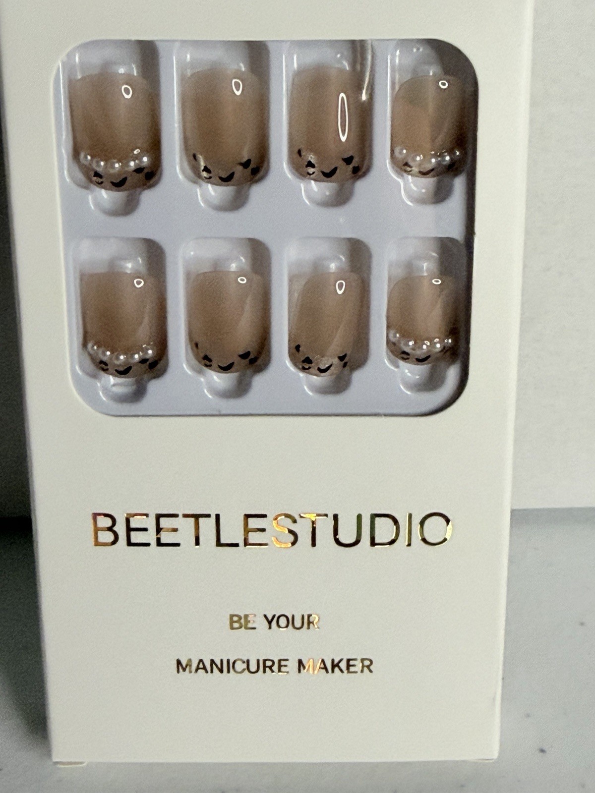 Short nail bundle. 4 sets, multiple sizes in each set. Brush on glue.