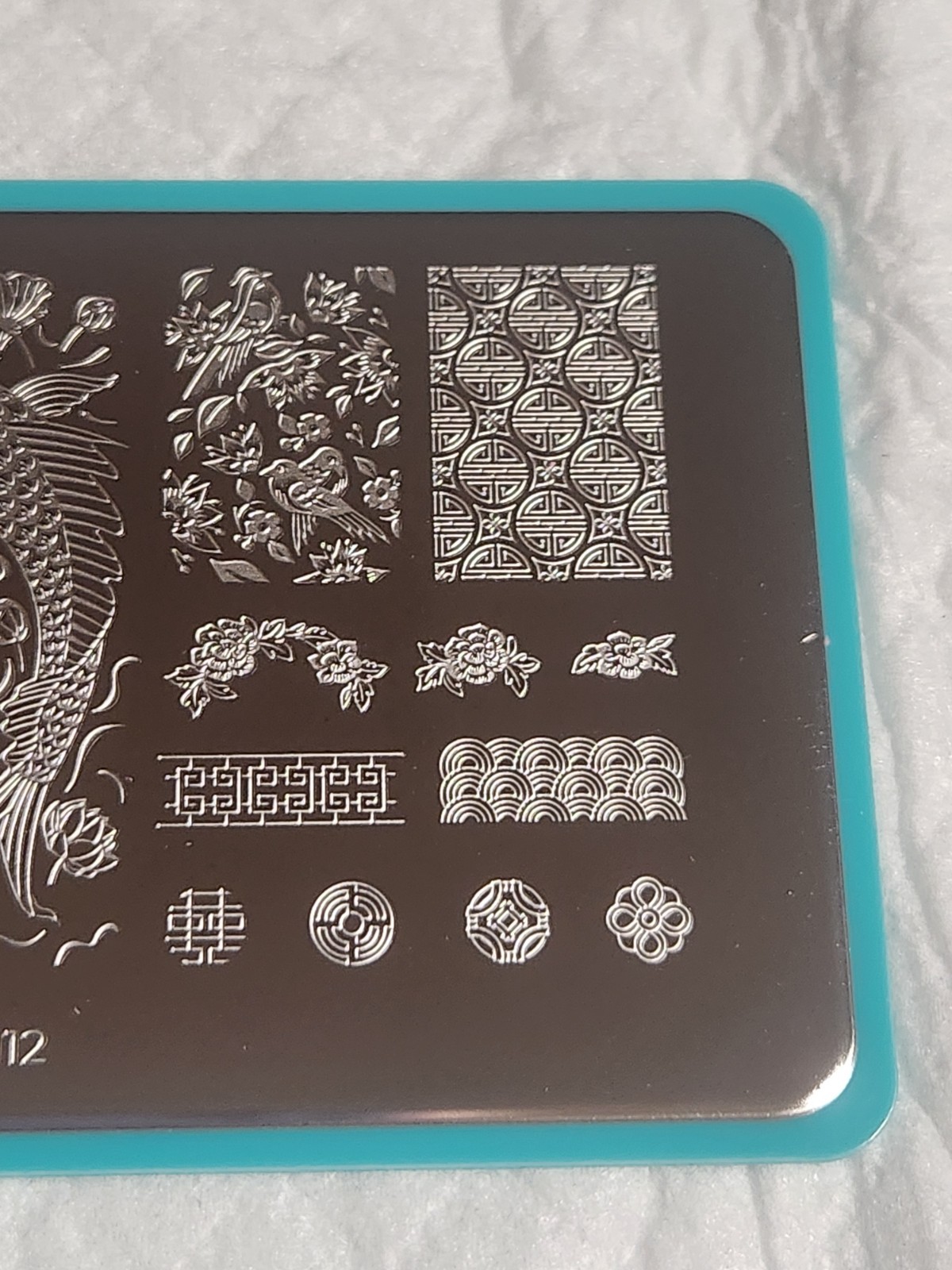 Maniology Nail Stamping Plate – M112 – Koi Pond