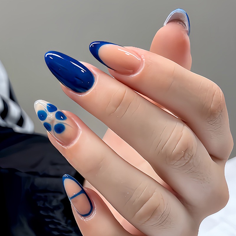Minimalist Fake Nails with Nude Base, Navy Blue French Tips and Floral Details