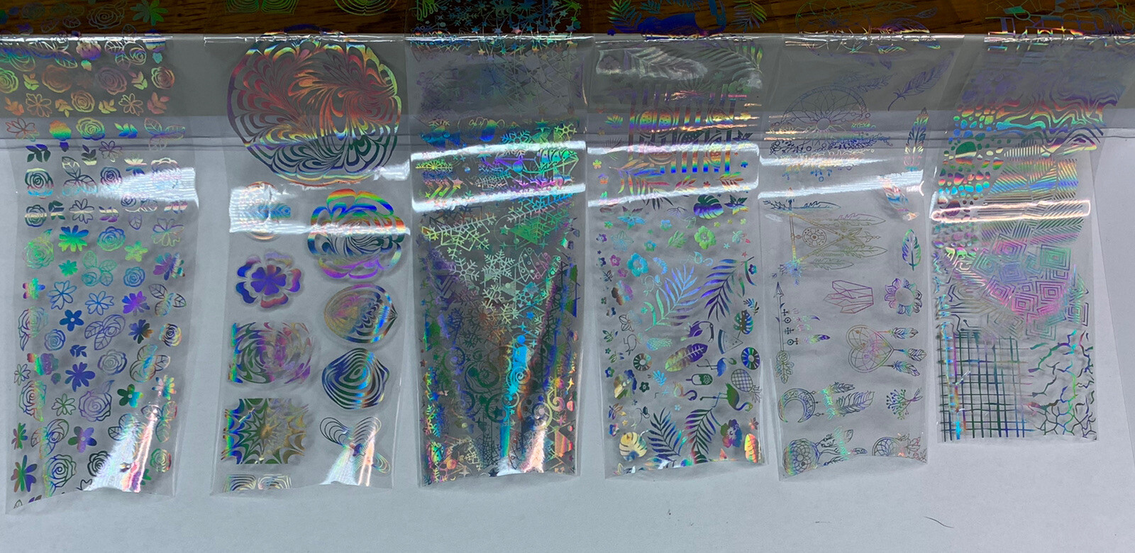 7 pcs Holographic Nail Art.  Each piece is over 8 inches.  Give that HOLO-look