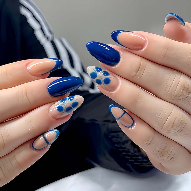 Minimalist Fake Nails with Nude Base, Navy Blue French Tips and Floral Details