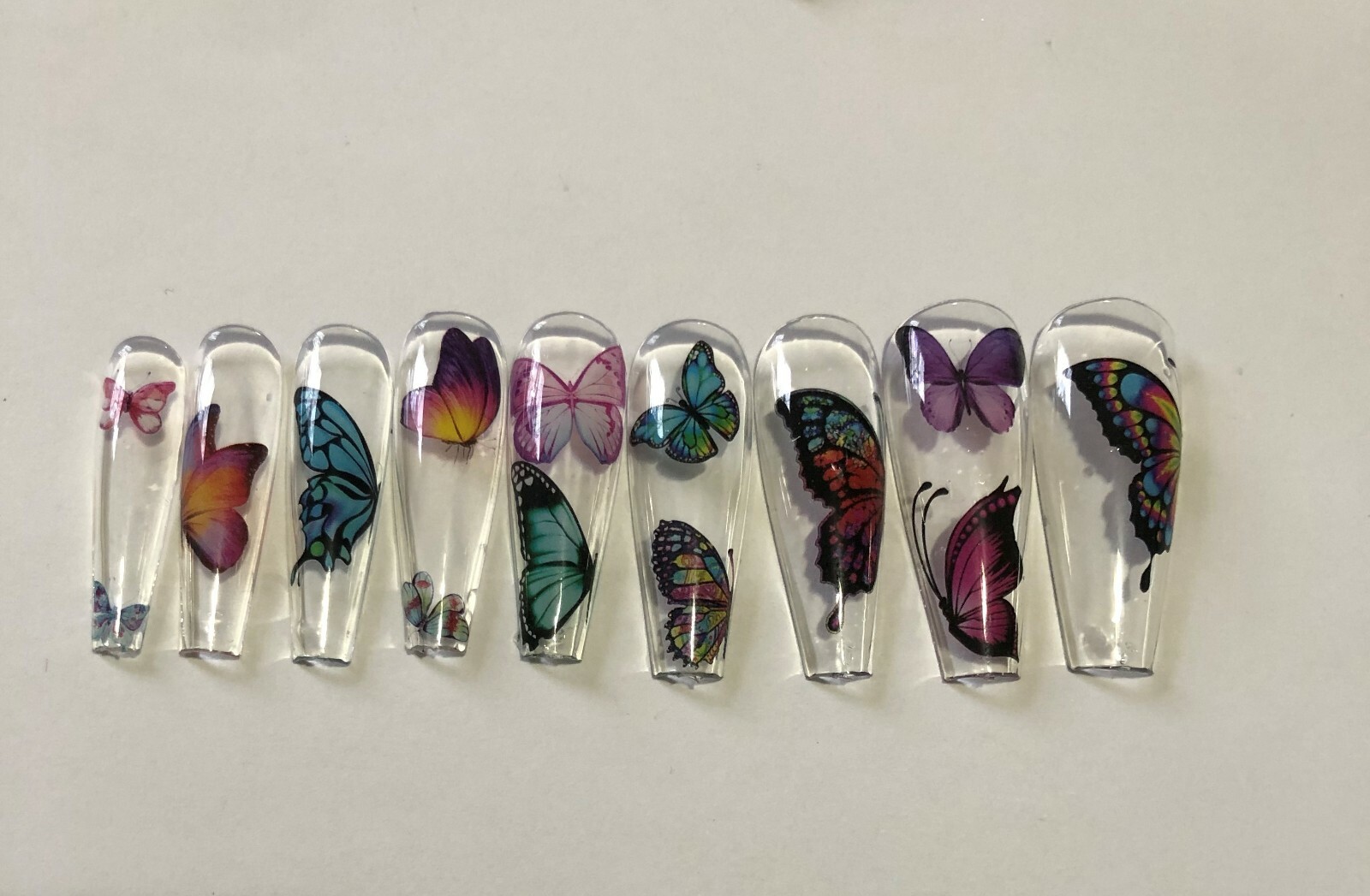 Press on nail set- Clear with Butterfly’s- (Set of 18 sizes 0-8)