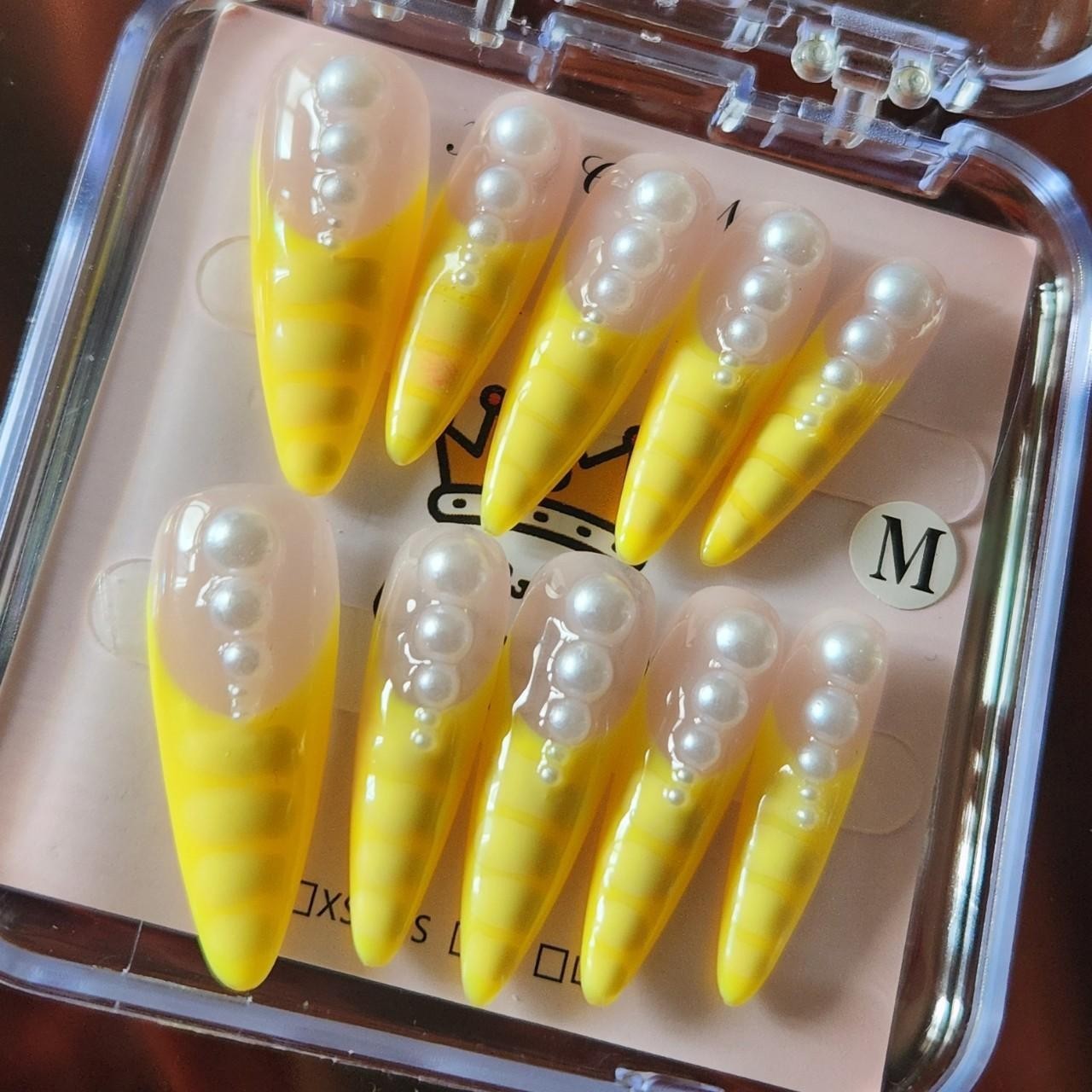 3.0 Yellow French tip stiletto press-on nails with pearls. Size M.