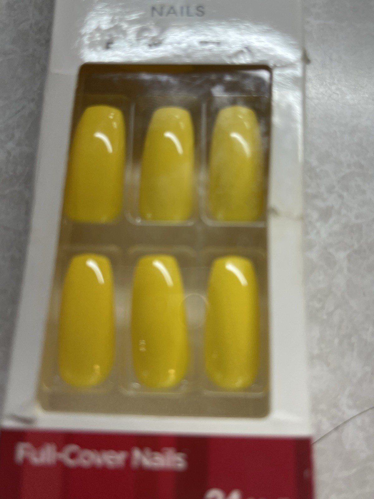 KISS Salon Color Ready-to-Wear nails in a glossy yellow finish.