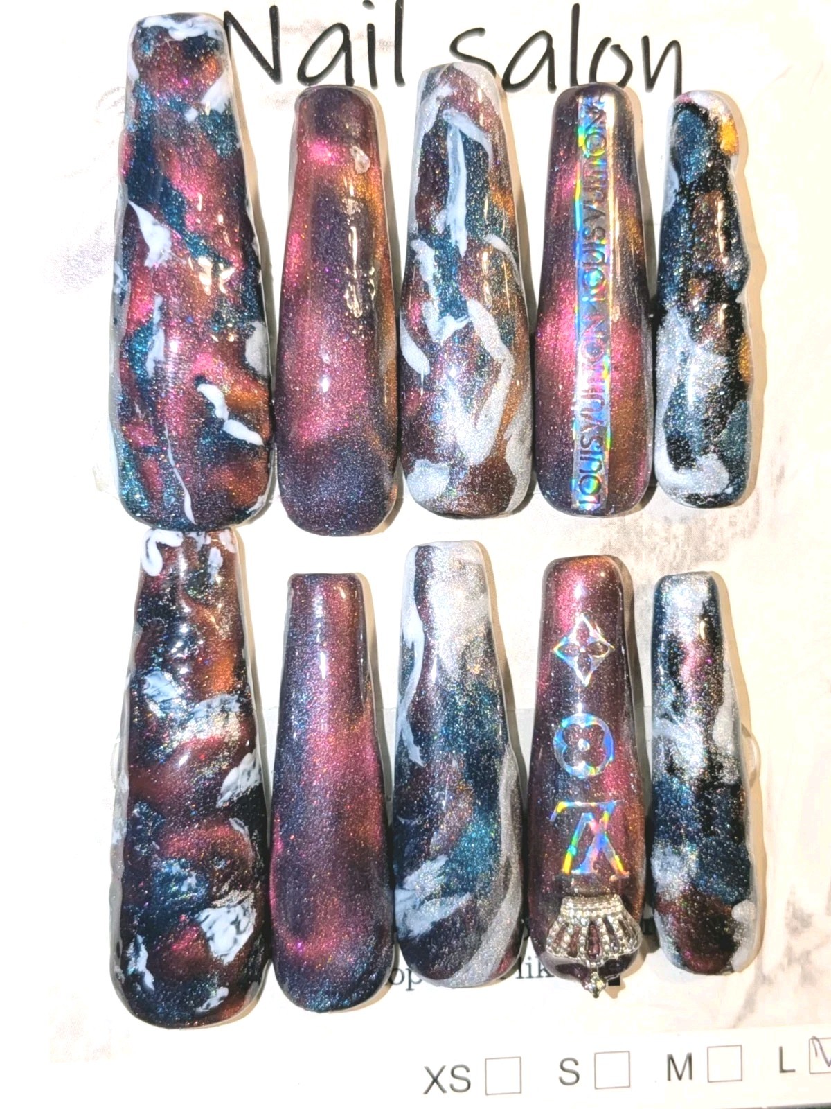 Shimmering Handmade Stunning galaxy-themed press-on nails with a mix of colors.