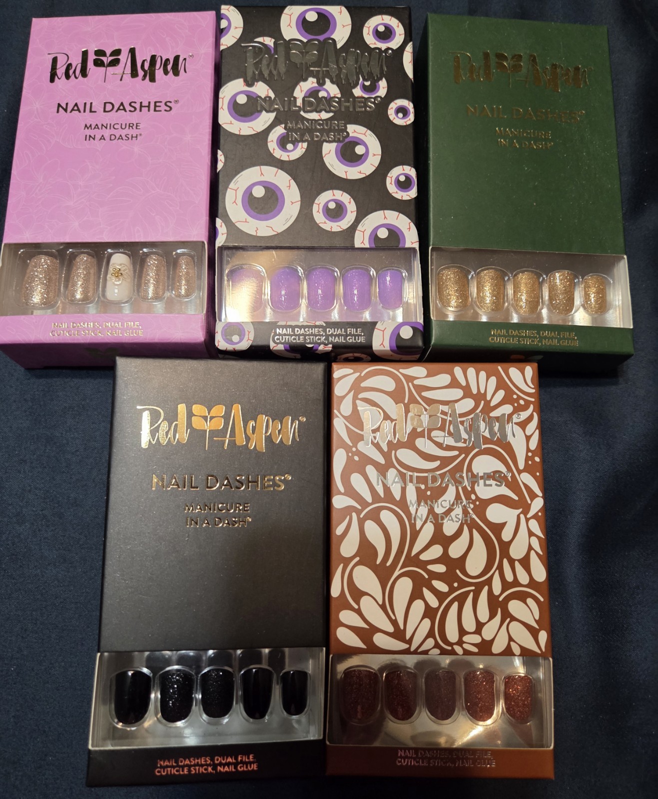 32 Sets of Red Aspen Press-On Nails including Acrylic and Multicolor Glitter