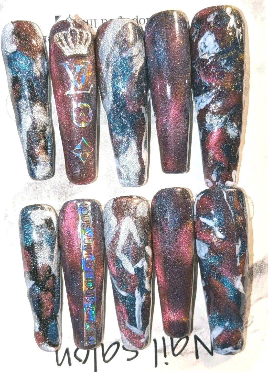 Shimmering Handmade Stunning galaxy-themed press-on nails with a mix of colors.
