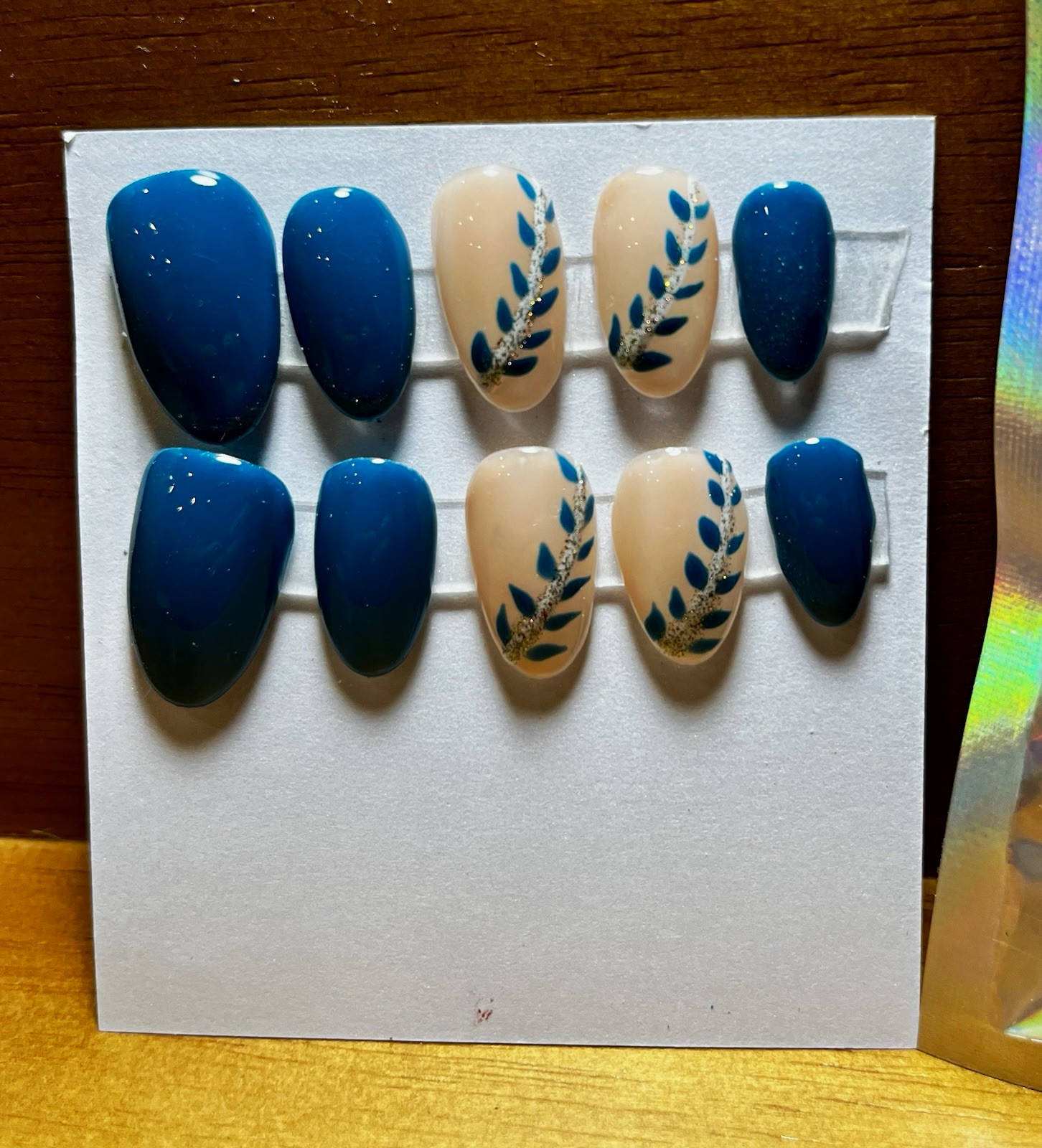 Oval Medium Plastic Press-On Nails Blue & Beige Leaves