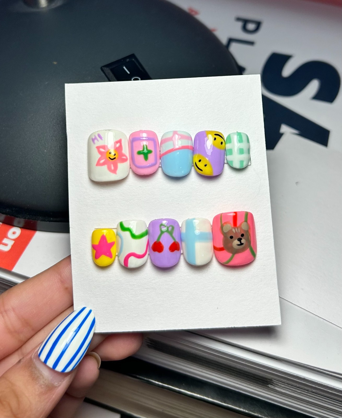 Multi-colored acrylic nails with cartoon characters and patterns #kawaii