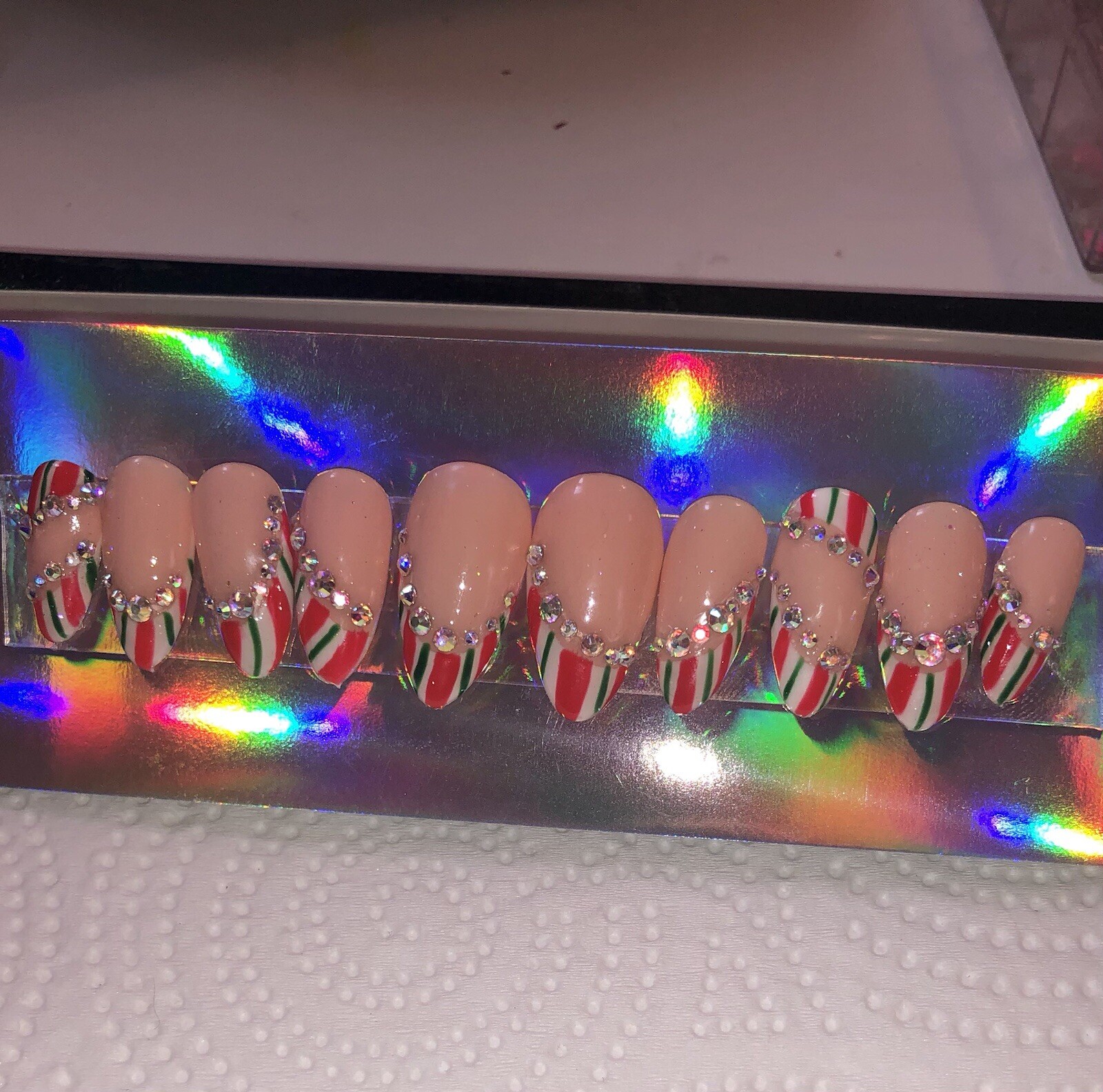Festive Holiday Red and White Striped Nail Set with Rhinestones