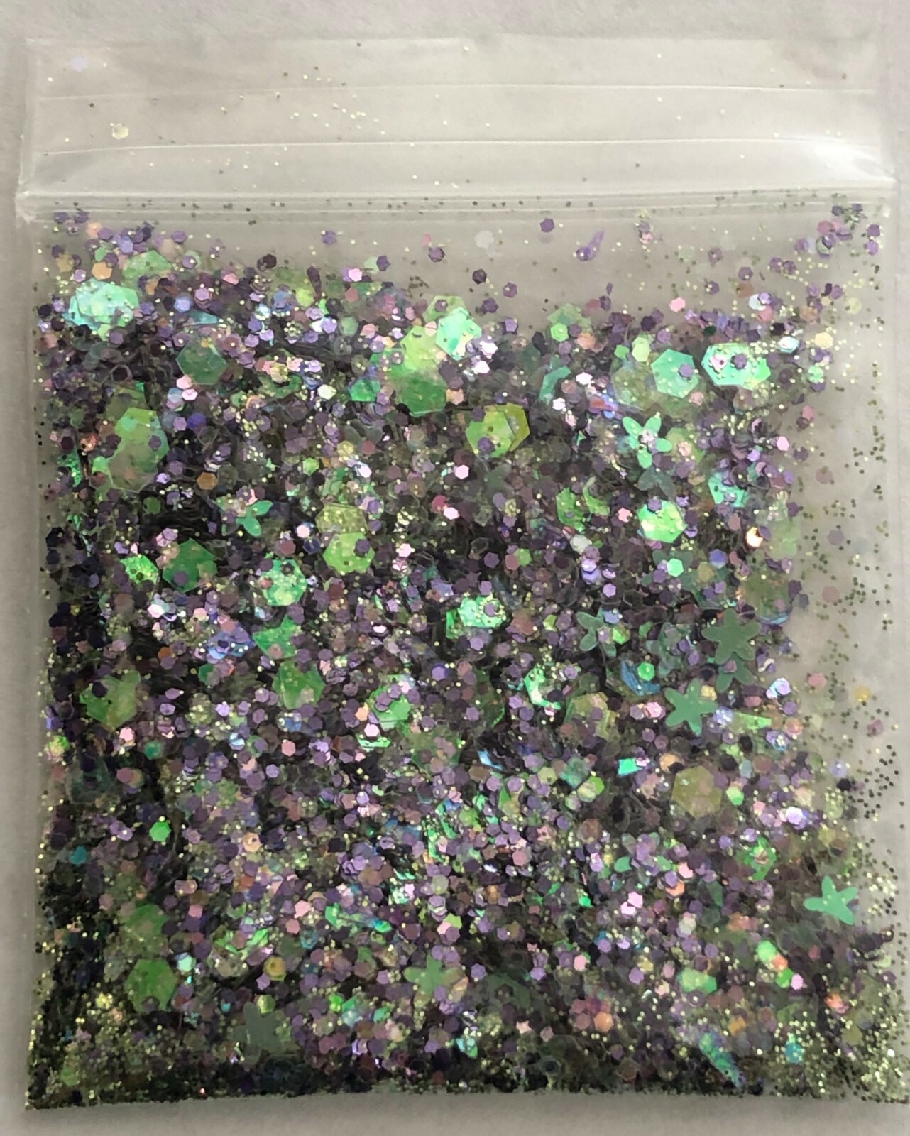 Purplelicious glitter mix for acrylic or gel nail application.