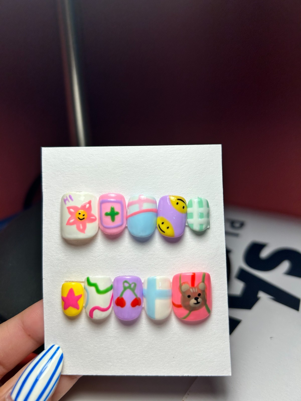Multi-colored acrylic nails with cartoon characters and patterns #kawaii